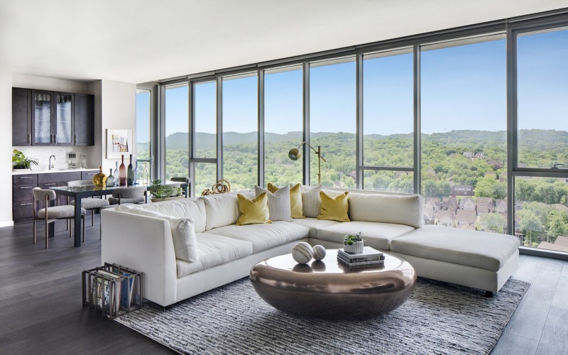 Penthouse with sectional view of green hills in background