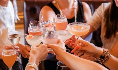 Women Toasting with Cocktails