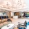 Foyer with unique light fixtures loveseat and chairs