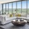 Spacious and well lit living room with wood floors and an open floor plan with access to the kitchen.