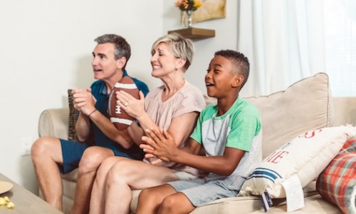 Family watching football on TV