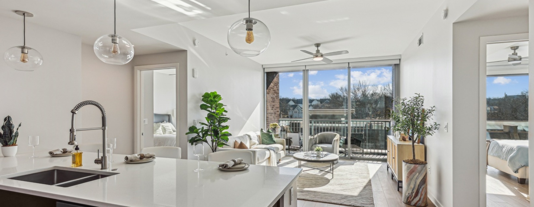 Expansive view of the kitchen and living room with windows